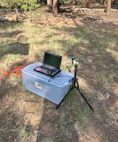 The fielded prototype: a camera on a tripod capturing to a laptop