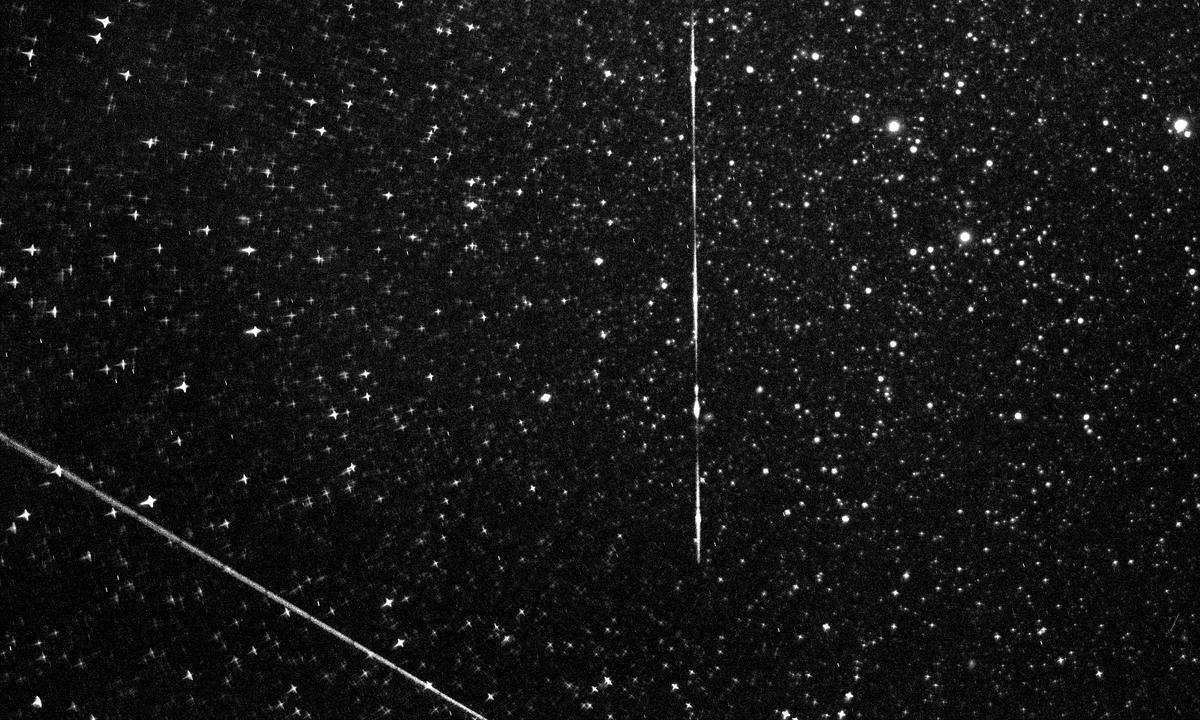 Stacked field frames from the sensor: stars and two satellite tracks